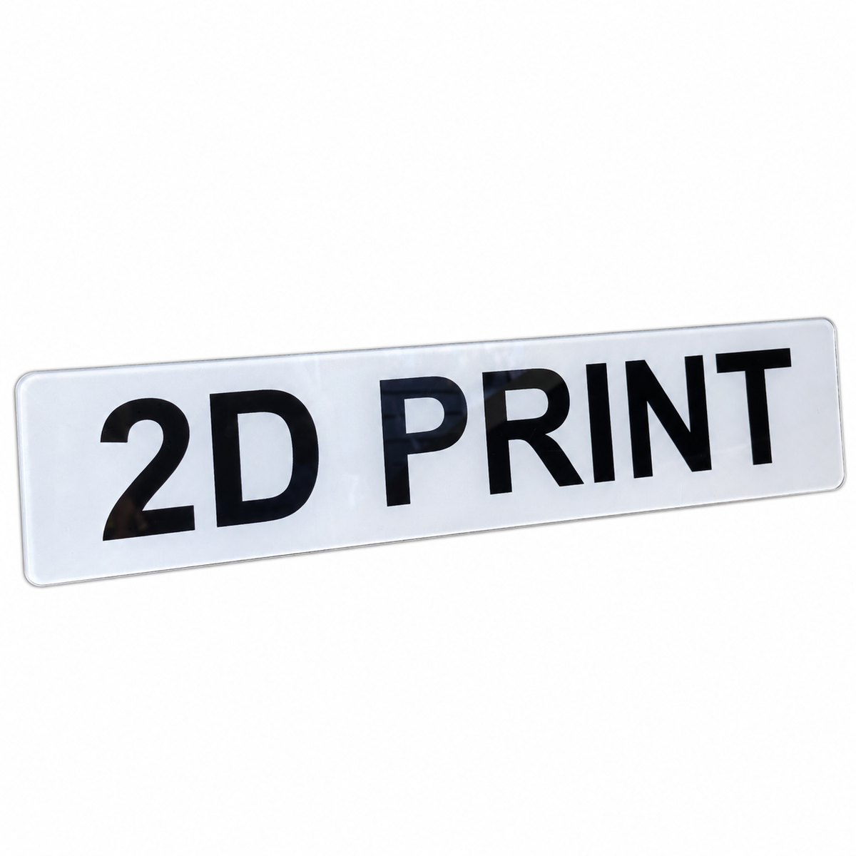 A white rectangular sign with rounded corners and the text '2D PRINT' in large black letters, shown on a plain white background.