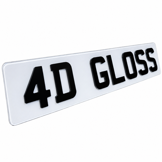 A glossy white rectangular license plate or badge with raised black lettering reading '4D GLOSS', shown at an angle on a plain white background.